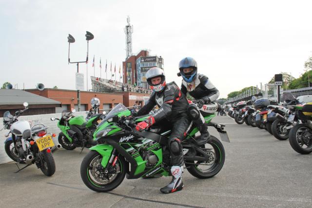 riding pillion on a motorcycle